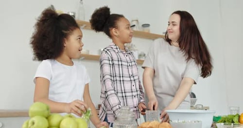 Family Cooking Together in Sunny Kitchen at Home