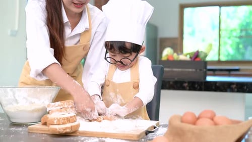 Professional pastry chef asian mom and son making bakery bread cake prepare delicious sweet food
