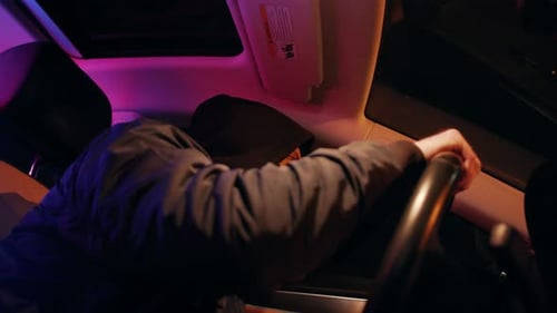 Masked Person Drives Vehicle with Police Lights