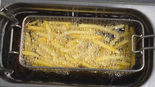French Fries Cooking in Oil, Close Up