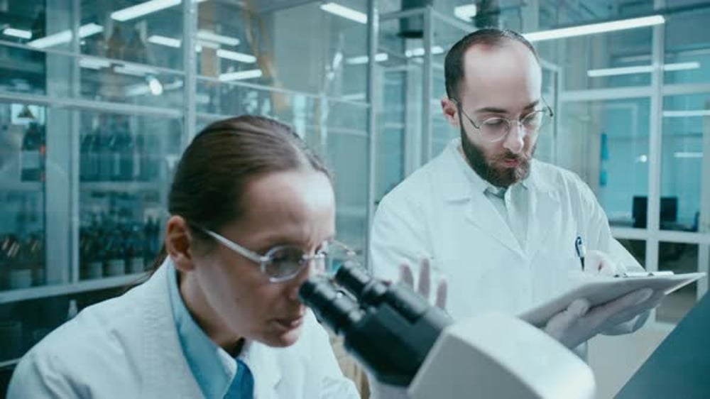 Scientists Working With Microscope in Laboratory, Science Stock Footage ...