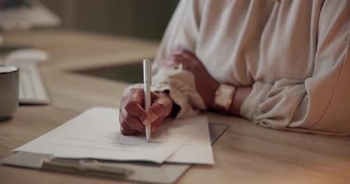 Adult Hands Signing Legal Paperwork in Office