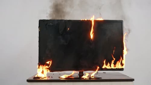 Damaged Television Set Ablaze then Extinguished