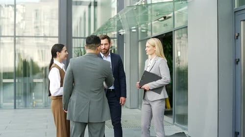 Business People Meeting Outside Office Building