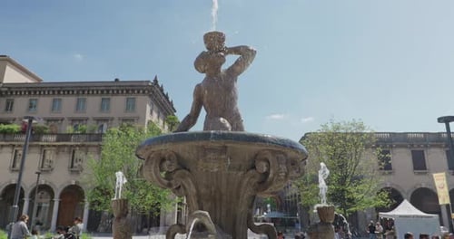 Closeup Of The Triton Fountain (Fontana della Fiera) On The Ancient Piazza Dante In Bergamo, Italy.