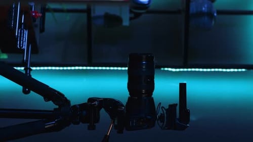 Vertical Video Professional Camera Equipment in Empty Blue Neon Lit Creative Photography Studio