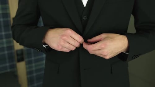 Businessman Closeup Buttoning His Suit Before Business Meeting Closeup A Male Businessman is