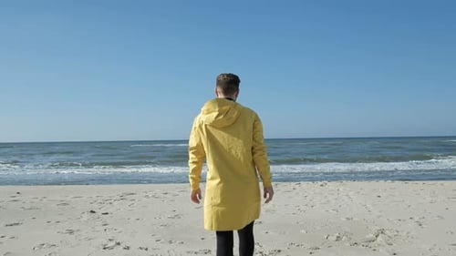 One Adult Guy Stand Alone, Look At The Waterline And Enjoy To Successful Moment At Hiking Journey...