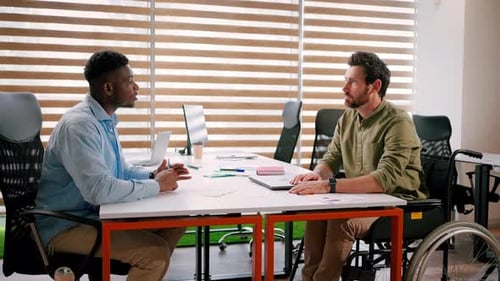 Men Talking and Shaking Hands in Office