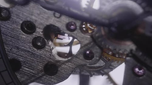 Gears spinning a ticking watch - Macro shot