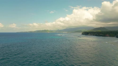 Aerial View on Tropic Island with Turquoise Ocean with Pal Trees at Cloudy Weather on Candidasa Bali