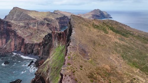 Aerial above and along dramatic precipitous sea cliffs, Ponta de São Lourenço