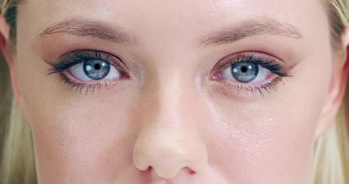 Blue eyes, woman and eyelashes with zoom on face for vision, focus and eyesight with eye care