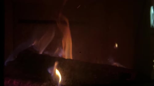 Glowing Fireplace with Dancing Flames and Burning Wood
