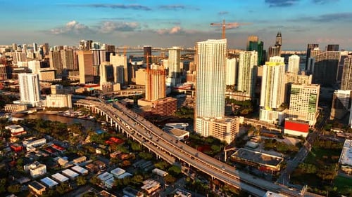 Bright light of setting sun illuminating the skyscrapers in the uptown of Miami,