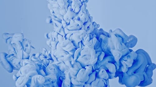 SlowMotion Blue Paint Drops Mixing in Water Captivating Stock Footage