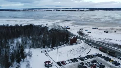 Flight of a drone near a large mammoth monument in Salekhard