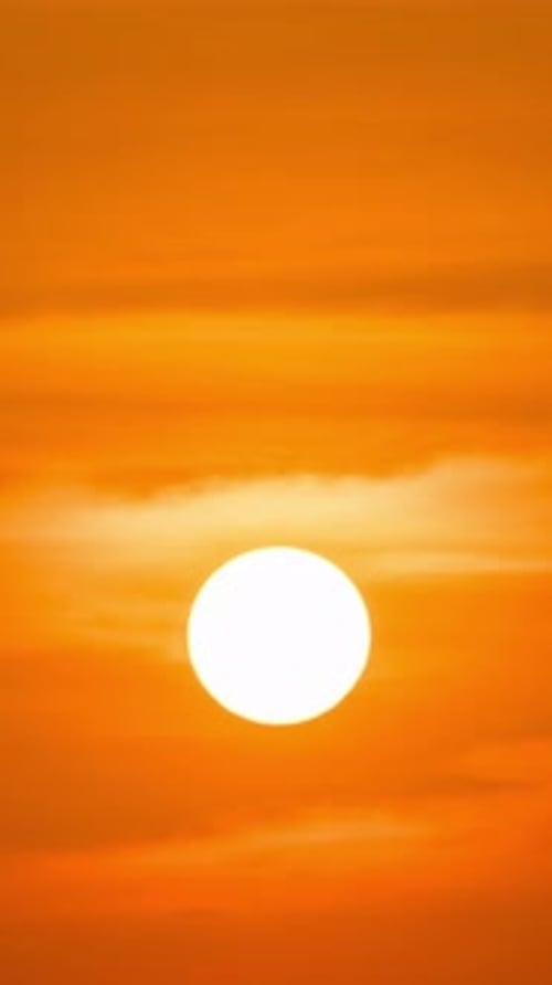 Sun Shines Brightly in Orange Sky
