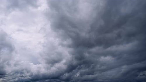 Dark Storm Clouds Moving Across Grey Sky