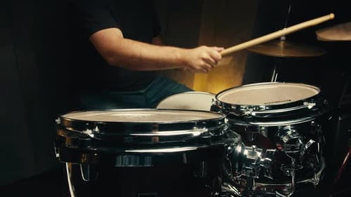 Expressive Drummer Young Man Professionally Playing on Dums in Studio Room Closeup Rock Metall Music