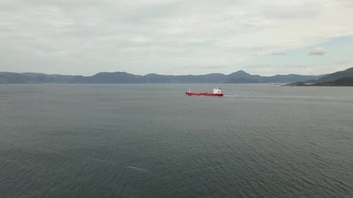 Empty Cargo Ship closing in on Norway's Most Dangerous Waters; Stadthavet. Aerial drone video follow