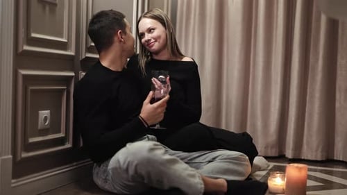 Romantic Couple Enjoying Intimate Evening at Home with Wine