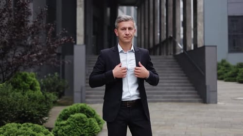 Confident Businessman in Suit at Office Building