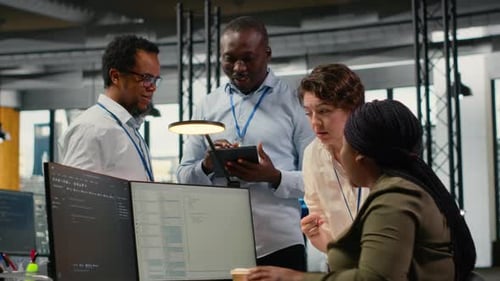 Team of Software Developers in Office Working Together Automating Using AI