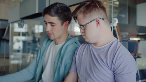 Young Adults Working Collaboratively in Creative Office Space