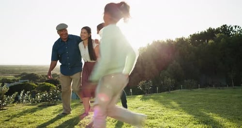 Happy Multi-Generational Family Walking Together Outdoors