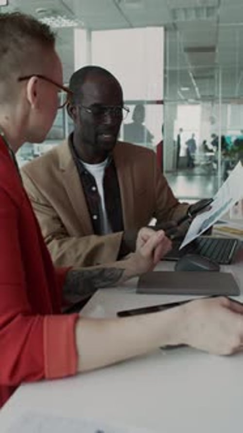 Business Meeting at Desk in Modern Office