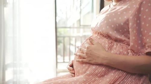 Close up Pregnent woman touching pregnancy at home