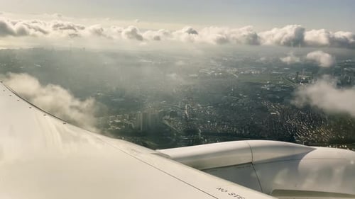 Point of view of seated passenger inside air airplane craft next to wing motor turbine closeup with