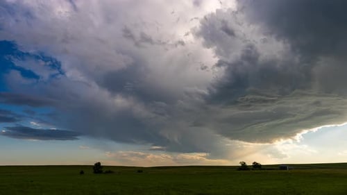Dramatic Sky Over Flat Rural Landscape at Sunset