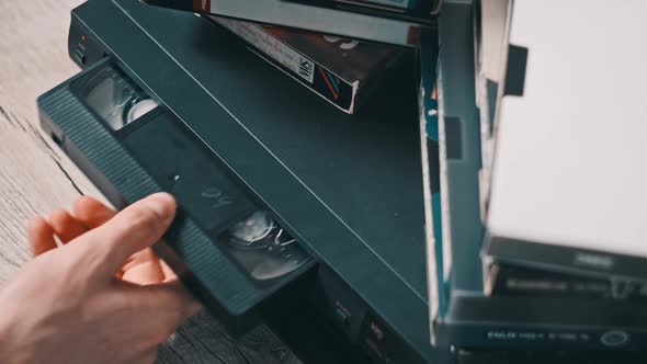 Inserting VHS Tape into VCR Player Close Up, Technology Stock Footage ...
