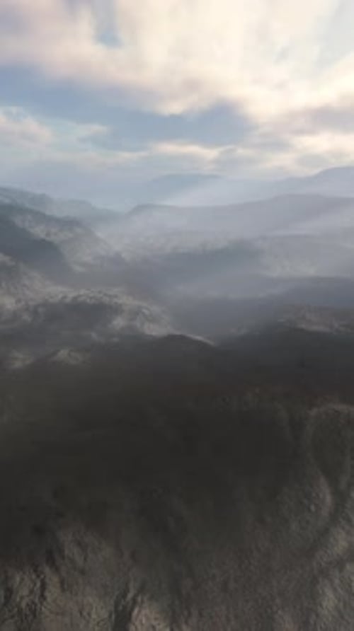 Majestic Mountain Range Under a Dramatic Cloudy Sky