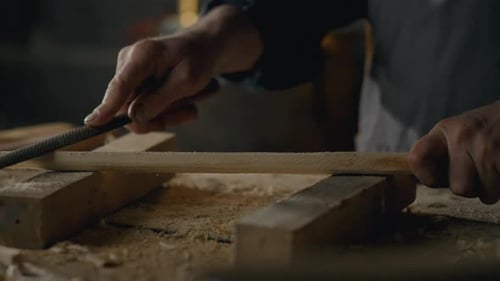 A woodworker works in a furniture making workshop, The process of processing wood with special