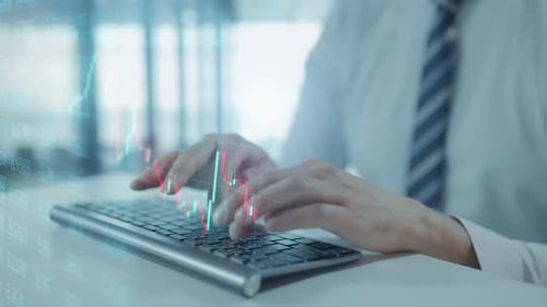 Trader is Working with Computer Screen with Stock Charts and Data Analysis Broker Trading Online