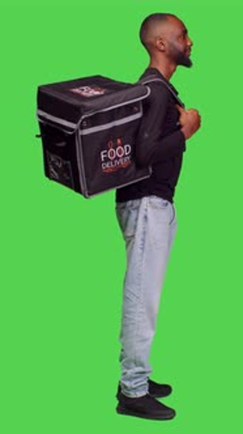Vertical Video Profile of African American Person Working As Deliveryman on Camera