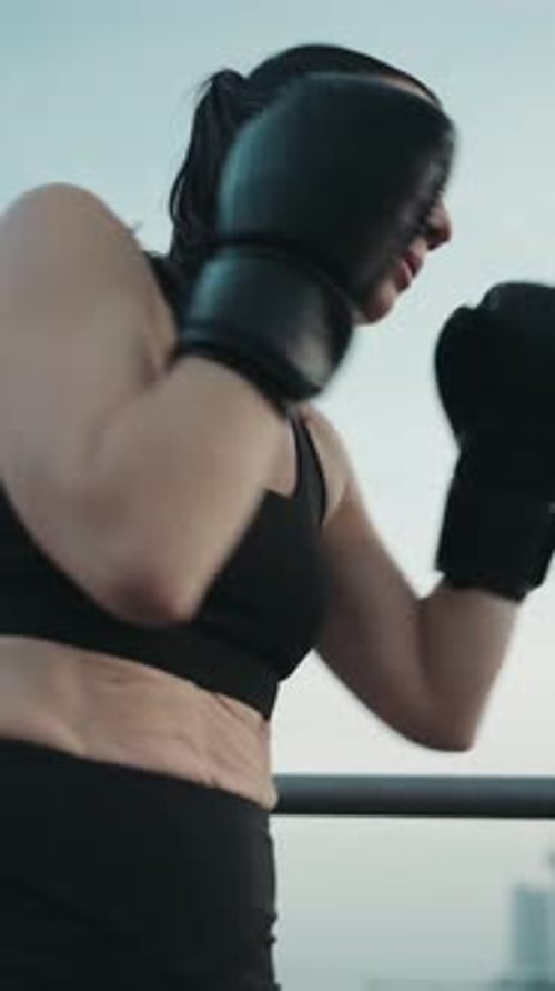 Athletic Woman Shadow Boxing in City Mid Shot