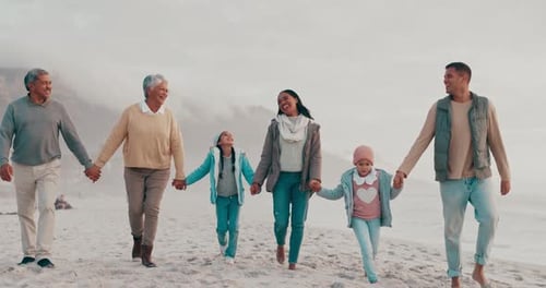 Travel, walking and big family holding hands on beach while on a tropical vacation or holiday