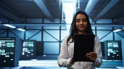 Admin in Data Center Monitoring Security Threats with Tablet