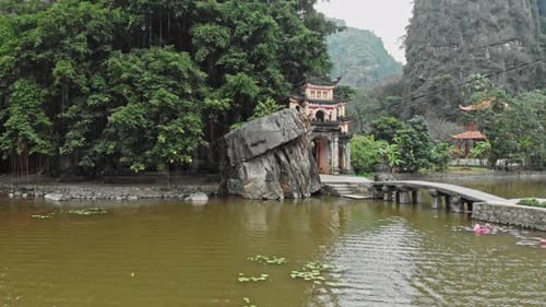 Outdoor park landscape with stone bridge and lake