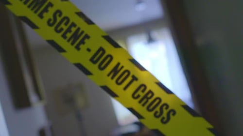 Crime Scene Tape Blocking Entrance in House