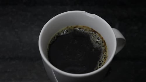 Coffee in a White Mug Close Up