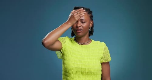 Fail, mistake and black woman in studio with stress, disappointed or regret with anxiety