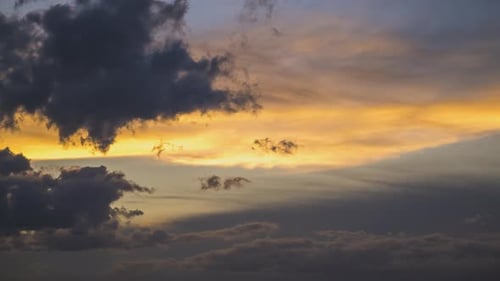 Time Lapse Footage of Fast Moving Clouds on Yellow Sky at Sunset