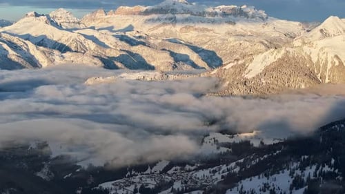 Aerial drone view of snow on the mountains in the Dolomites, Italy