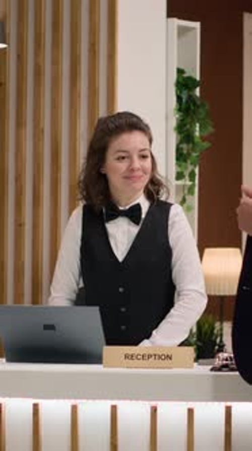 Vertical Video Hotel Concierge Verifying Passport Id