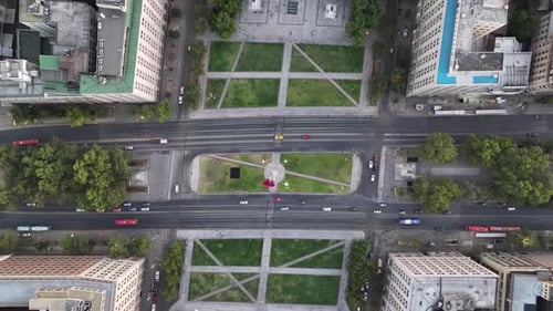 Aerial View of a City Intersection with Buses and Cars